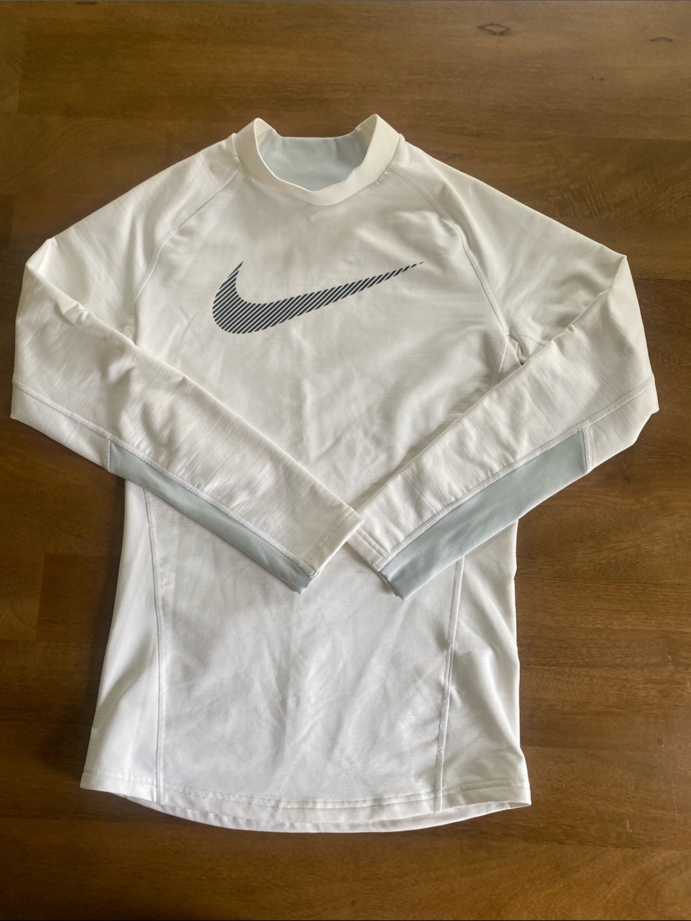 Nike Youth White Long Sleeve Performance Top with Black Swoosh